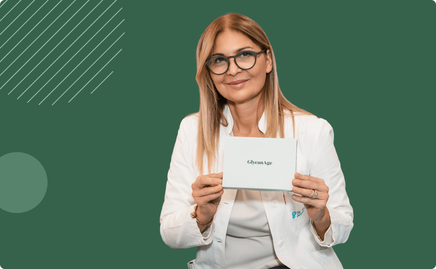 Doctor holding a GlycanAge test kit box and smiling at the camera