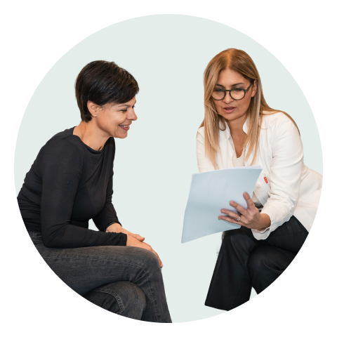 Patient and doctor reviewing GlycanAge results on a laptop